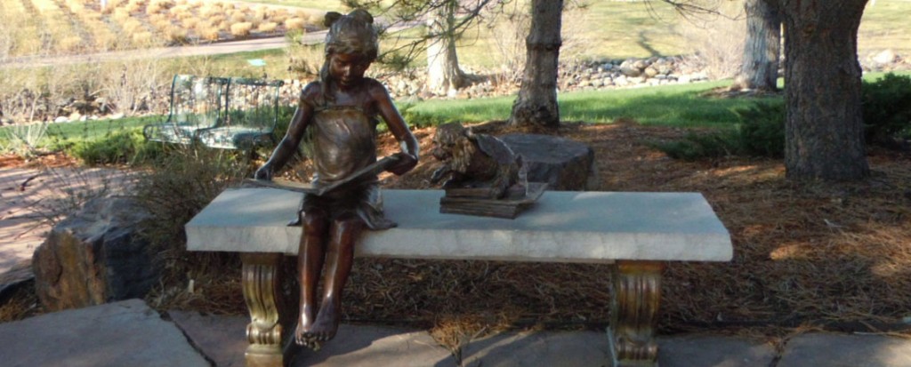 Parker Library Park girl reading book statue