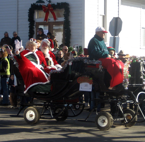 santa claus is coming to town during the holiday christmas carriage parade downtown parker colorado